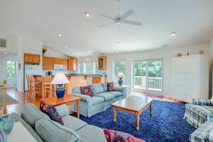 a living room with a couch and a table at 3215 - Papa Duck in Duck