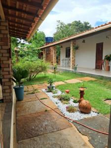 a backyard with a garden with a rock pathway at aguapé apartamento 2 in Barreirinhas