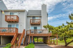 a house with balconies and decks on it at 4220 - Timeless in Duck