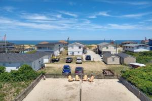 an aerial view of a house with cars parked in a yard at 4749 - Salty Dawgs in Kitty Hawk Beach