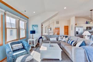 a living room with a couch and two chairs at 4749 - Salty Dawgs in Kitty Hawk Beach +46 photos