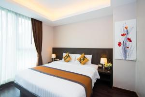 Postel nebo postele na pokoji v ubytování Tetris Hotel