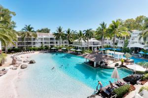 an overhead view of a pool at a resort at Elysium The Beach Club in Palm Cove