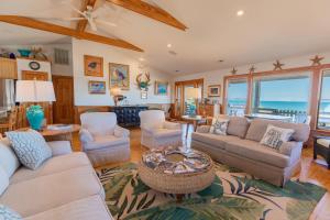 a living room with a couch and chairs and a table at 5451 - Richardson in Nags Head