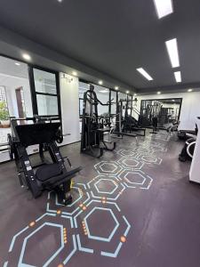 a gym with several treadmills and machines in a room at The Nairobi Experience in Nairobi