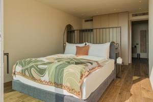 a bedroom with a large bed in a room at Villa Vallonga in Bardolino +21 photos