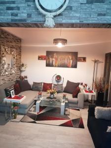 a living room with a couch and a table at Andros Residence in Limassol