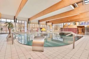 a large building with a pool in the middle at Becci Apartment-Free Parking in Kapfenberg