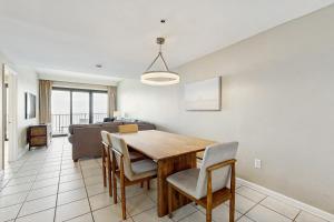 a dining room with a table and chairs at Phoenix I 1142 in Orange Beach