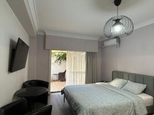 a bedroom with a bed and a view of a patio at Beach apartment's in Limassol