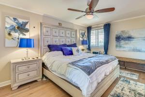 a bedroom with a large bed and a ceiling fan at Beachfront, Amazing 180-Degree View in Oceanside +23 photos