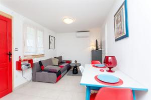 a living room with a couch and a table at House Ara in Grohote