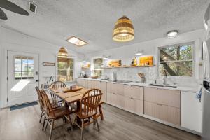 a kitchen with a dining room table and chairs at 7850 - Nepenthe in Frisco +30 photos