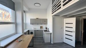 a small kitchen with a sink and a stove at atelier in Bratislava