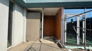 an open glass door on a building with a balcony at atelier in Bratislava