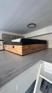 a large bed sitting on the floor of a room at atelier in Bratislava