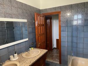 a bathroom with a sink and a mirror and a tub at Residenza Ticino in Oleggio +26 photos