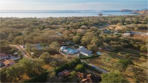 an aerial view of a house with a lake at Casa Frank - Sophiassuites506 in Brasilito