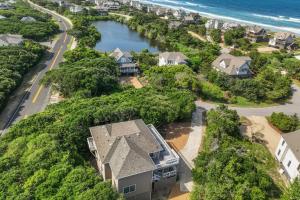 an aerial view of a house with the ocean at 2444 - Sea Forever in Duck