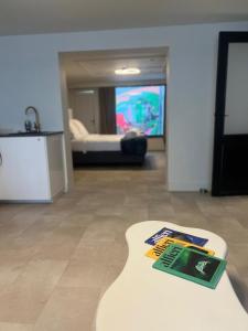 a table with a book on it in a living room at Modern Ground Floor Apartment in Ghent