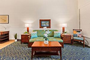 a living room with a couch and a table at Napili Shores E239 in Lahaina