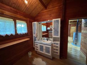 a bathroom with a sink and a mirror at écrin d'éveil in Campagne-lès-Guînes +9 photos
