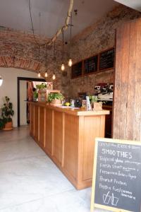 a restaurant with a counter with a sign in front of it at Casa H in San Miguel de Allende