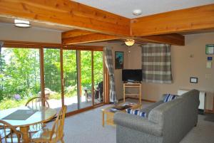 a living room with a couch and a table at Bayfield Island View Lodging, Bayfield, WI in Bayfield
