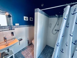 a bathroom with a shower and a sink at Hotel 108 in Glinde bei Hamburg in Hamburg +53 photos