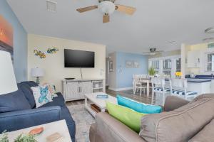 a living room with two couches and a tv at 7662 - Sea La Vie in Avon