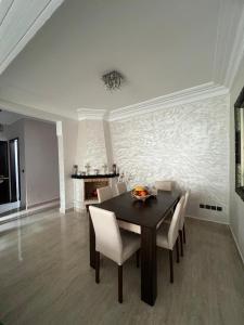 a dining room with a table and chairs at DreamCatcher ocean in Mohammedia