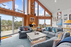a living room with couches and a table at 7828 - Swing Belly's Roost in Frisco +32 photos