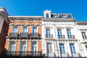 a tall building with balconies on the side of it at The Ghentian Suites by Domani Hotels in Ghent