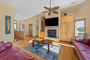 a living room with a couch and a fireplace at 3947 - Leg-O Duck in Duck
