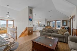 a living room with a couch and a table at 7200 - Better Surf Than Sorry in Salvo