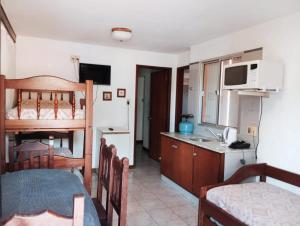 a small room with a kitchen and a bedroom at Natural Agave in Termas del Daymán
