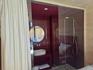 a bathroom with a shower with a toilet and a sink at Jules - Come Together in Stuben am Arlberg +33 photos