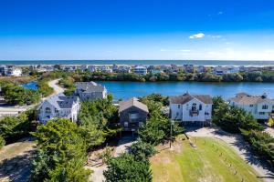 an aerial view of homes with the ocean in the background at 8194 - Southern Grace in Waves
