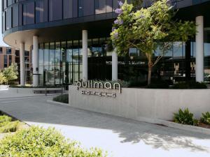 a building with a sign that reads cullman hotels at Pullman Sydney Penrith in Penrith