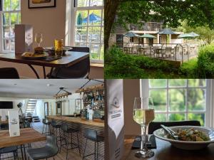 a table with a bowl of food and a glass of wine at 3 Lake View in Looe