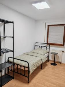 two bunk beds in a room with a window at Unterkunft 24 in Aldingen