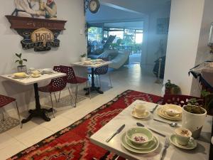 a dining room with a table with plates and utensils at Whitfords Garden Retreat in Perth