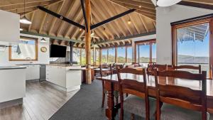 a kitchen and dining room with a table and chairs at Eagles Nest in Mount Hotham
