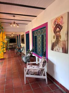 a room with a chair and a painting on the wall at Casa Roma in Rivera +15 photos
