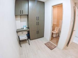 a small bathroom with a sink and a toilet at Stay Inn Apartelle in Roxas City +22 photos