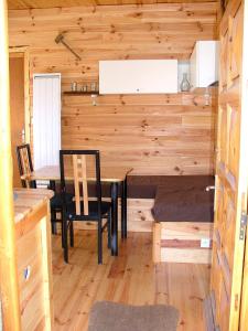 a dining room with a table and chairs in a cabin at studio MONT LOUIS in La Cabanasse