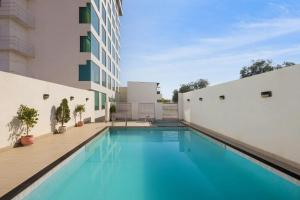 a swimming pool in the middle of a building at The Fern Residency Jodhpur, Series by Marriott in Jodhpur