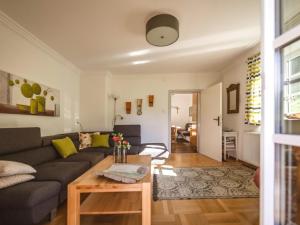 a living room with a couch and a table at Naturpark Chalet Schladming-Dachstein in Großsölk