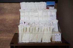 a display of white toilet paper on a table at HOTEL R9 The Yard Mobaramutsuno in Machibo +16 photos