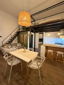 a dining room with a table and some chairs at Apart Hotel CABA in Buenos Aires